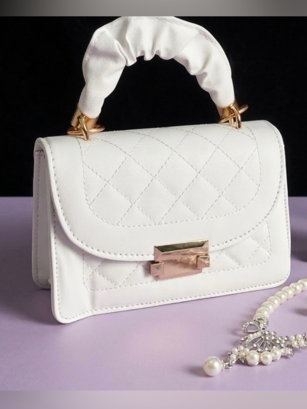 Women Mini white and gold purse.